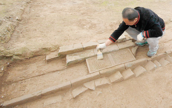 The excavation team member works on the site of the ruins of Daming Palace. Provided to China Daily