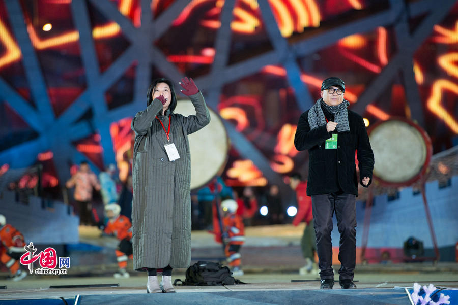 The New Year celebration 'Countdown to 2015' holds its last rehearsal at Beijing's Olympic Park, where the national symbols of the Bird's Nest stadium and the Water Cube National Aquatics Center are located, on Tuesday, Dec. 30, 2014. The ceremony also features the Chinese capital's bidding for the 2022 Winter Olympics. [Photo by Chen Boyuan / China.org.cn]