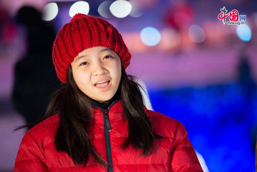 Lin Miaoke and her friends sing at the rehearsal of Countdown to 2015, the New Year celebration, on Dec. 30, one day ahead of the actual ceremony. The New Year celebration 'Countdown to 2015' holds its last rehearsal at Beijing's Olympic Park, where the national symbols of the Bird's Nest stadium and the Water Cube National Aquatics Center are located, on Tuesday, Dec. 30, 2014. The ceremony also features the Chinese capital's bidding for the 2022 Winter Olympics. [Photo by Chen Boyuan / China.org.cn]