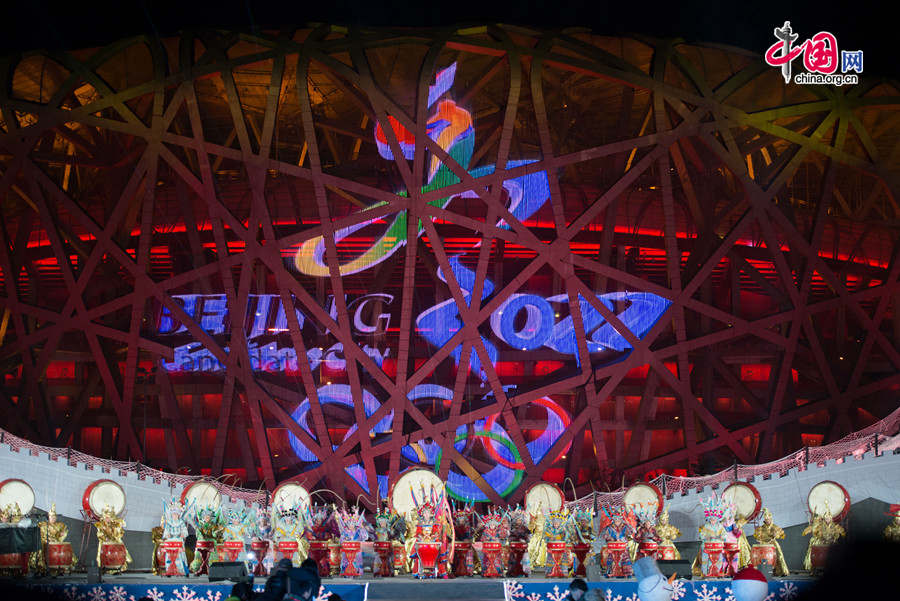 The New Year celebration 'Countdown to 2015' holds its last rehearsal at Beijing's Olympic Park, where the national symbols of the Bird's Nest stadium and the Water Cube National Aquatics Center are located, on Tuesday, Dec. 30, 2014. The ceremony also features the Chinese capital's bidding for the 2022 Winter Olympics. [Photo by Chen Boyuan / China.org.cn]