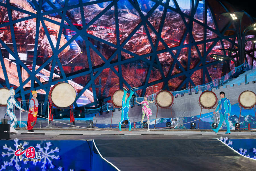 The New Year celebration 'Countdown to 2015' holds its last rehearsal at Beijing's Olympic Park, where the national symbols of the Bird's Nest stadium and the Water Cube National Aquatics Center are located, on Tuesday, Dec. 30, 2014. The ceremony also features the Chinese capital's bidding for the 2022 Winter Olympics. [Photo by Chen Boyuan / China.org.cn]