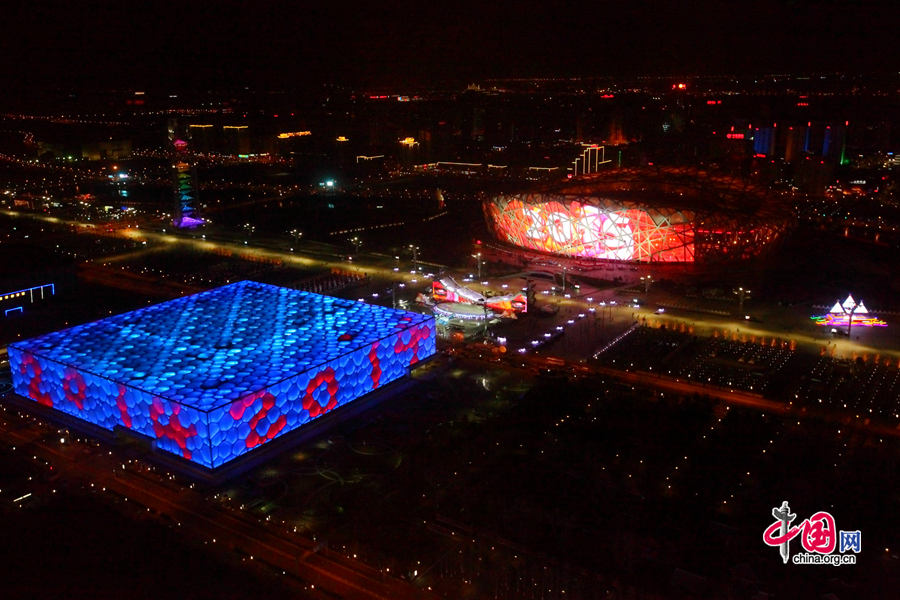 The New Year celebration 'Countdown to 2015' holds its last rehearsal at Beijing's Olympic Park, where the national symbols of the Bird's Nest stadium and the Water Cube National Aquatics Center are located, on Tuesday, Dec. 30, 2014. The ceremony also features the Chinese capital's bidding for the 2022 Winter Olympics. [Photo by Chen Weisong / China.com.cn]