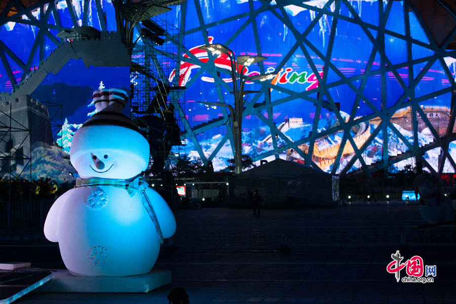 The New Year celebration 'Countdown to 2015' holds its last rehearsal at Beijing's Olympic Park, where the national symbols of the Bird's Nest stadium and the Water Cube National Aquatics Center are located, on Tuesday, Dec. 30, 2014. The ceremony also features the Chinese capital's bidding for the 2022 Winter Olympics. [Photo by Chen Boyuan / China.org.cn]