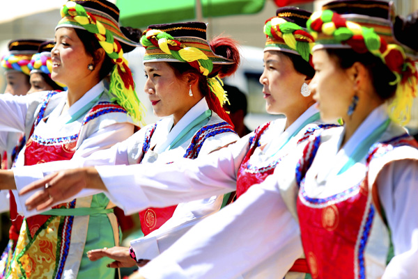 Women in traditional Tibetan costumes dance in Lhasa in March. 