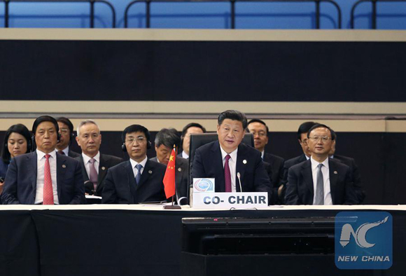 Chinese President Xi Jinping (front) attends a plenary meeting of the Johannesburg Summit of the Forum on China-Africa Cooperation in Johannesburg, South Africa, Dec. 5, 2015. [Photo/Xinhua]