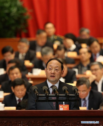 On behalf of the Taiwan Democratic Self-government League Central Committee and the All-China Federation of Taiwan Compatriots, Jiang Liping, a member of the 12th National Committee of the Chinese People's Political Consultative Conference (CPPCC), delivers a speech at the fourth plenary meeting of the fifth session of the 12th CPPCC National Committee in the Great Hall of the People in Beijing, capital of China, March 11, 2017. [Photo/Xinhua]