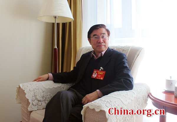 Huang Youyi, a member of the Chinese People's Political Consultative Conference and executive vice president of the Translators Association of China, talks to a China.org.cn reporter in Beijing, March 6, 2017. [Photo/China.org.cn]