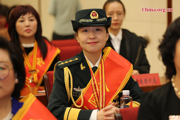 Captain Li Xiaomi receives the National March 8 Red-Banner Collective award on March 8, International Women's Day. [Photo provided to China.org.cn]