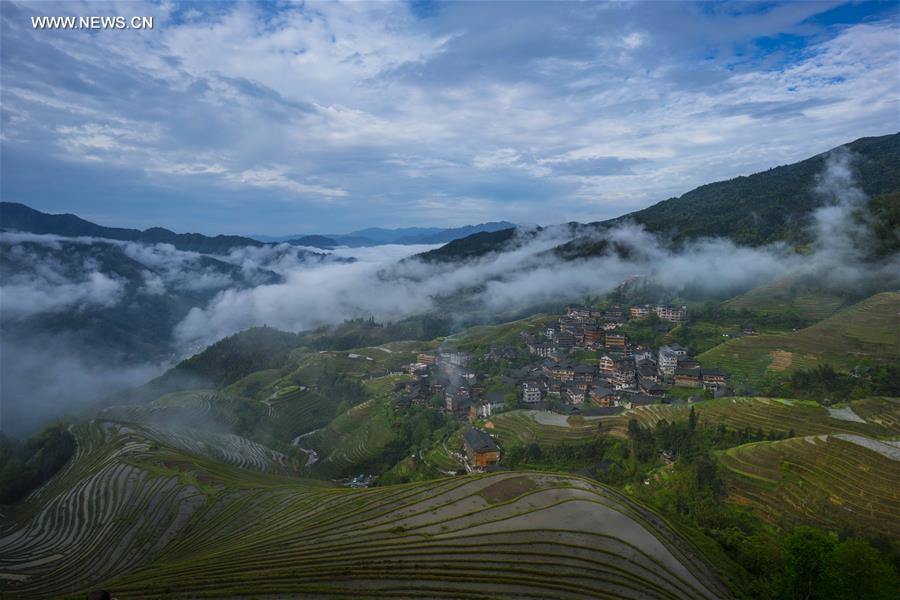Terraces shrouded by clouds in south China's Guangxi 