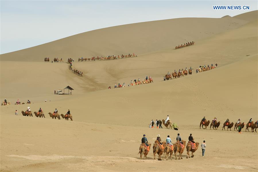 Mingsha Sand Mountain scenery zone in Dunhuang attracts tourists