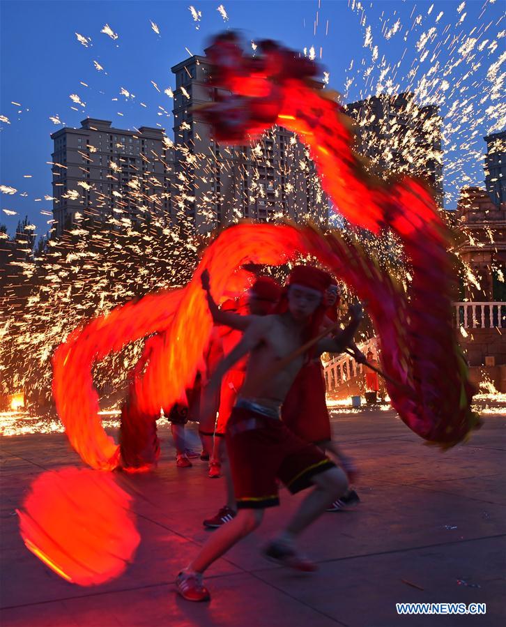 Dragon dance in splash of molten iron